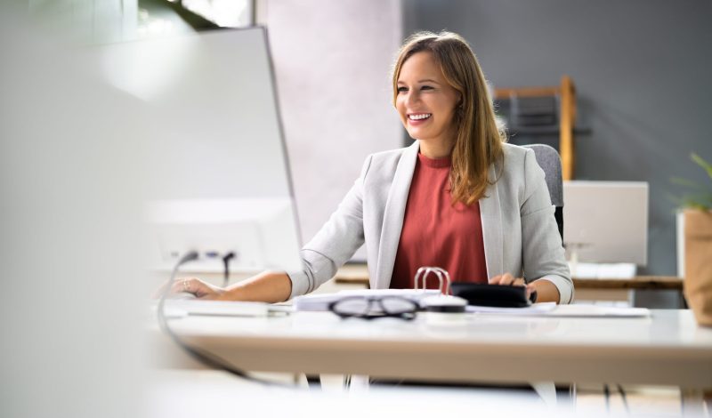 Accountant Women At Desk Using Calculator For Accounting